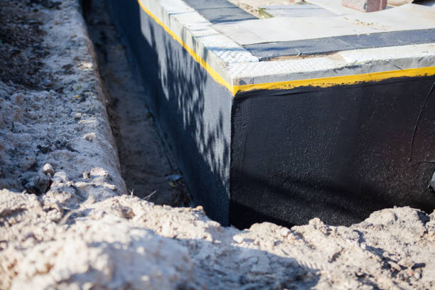 Professional Basement Waterproofing technician working in Saint Johns, MI